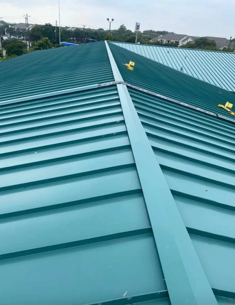 Green commercial metal roof ridge and valley for Metal Roof Repair in St. Anthony