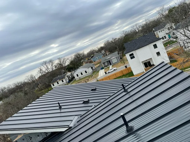 Standing seam metal roof panels with vents for Skylight Repair in St. Anthony